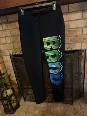 Black Sweatpants with Blue-Green Pixel Wave Graphic